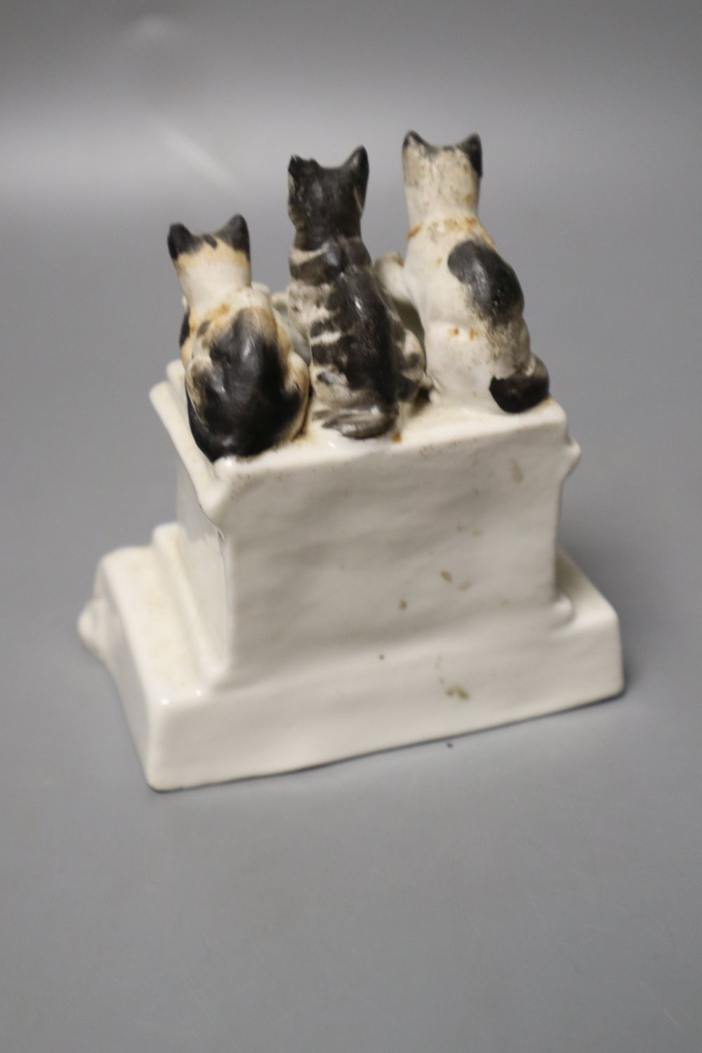 A humorous group of five cats having Five oclock Tea and a pottery sheep group, 9cm